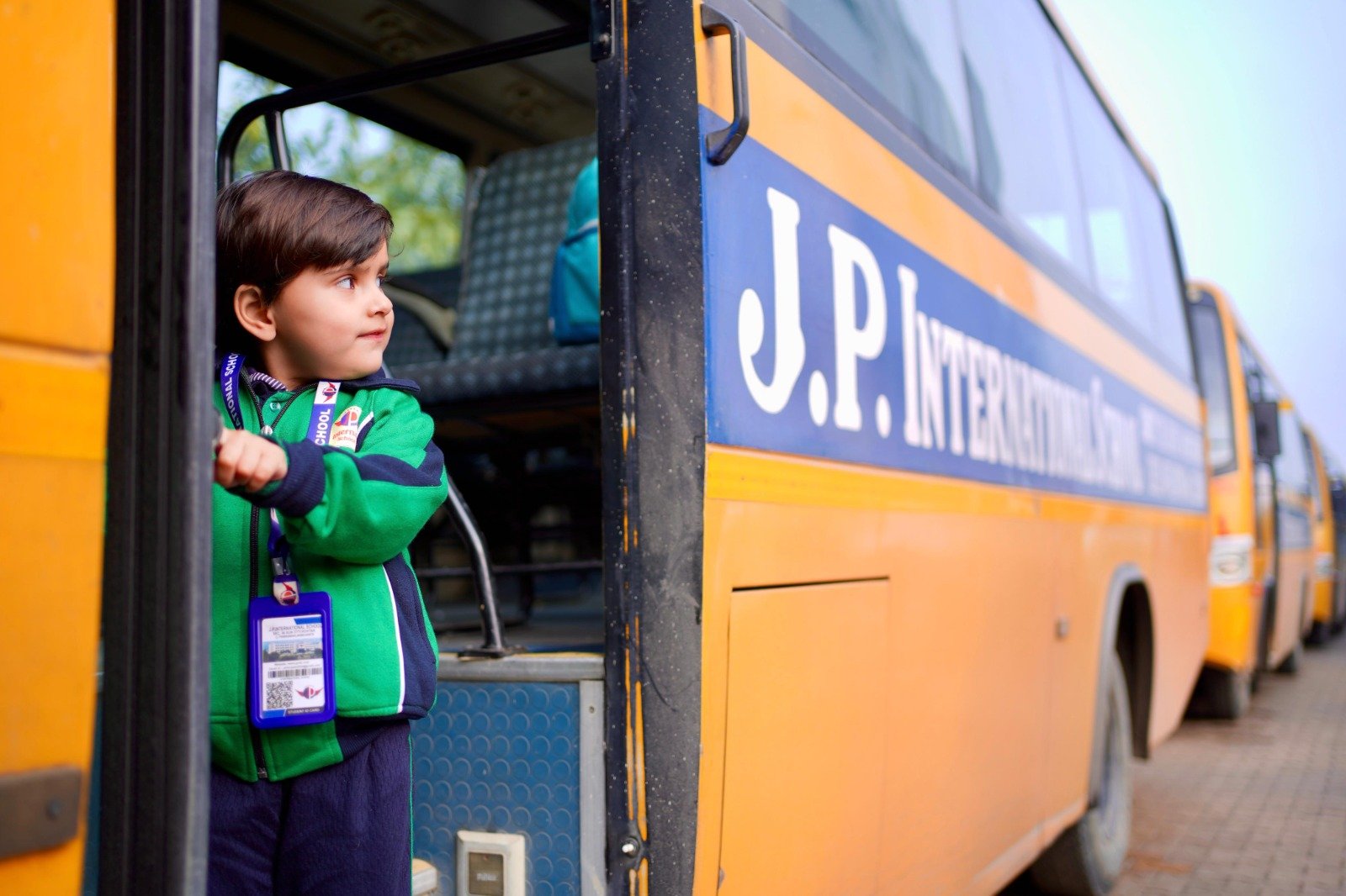 Safe school transport bus facility and arrival at JP International School