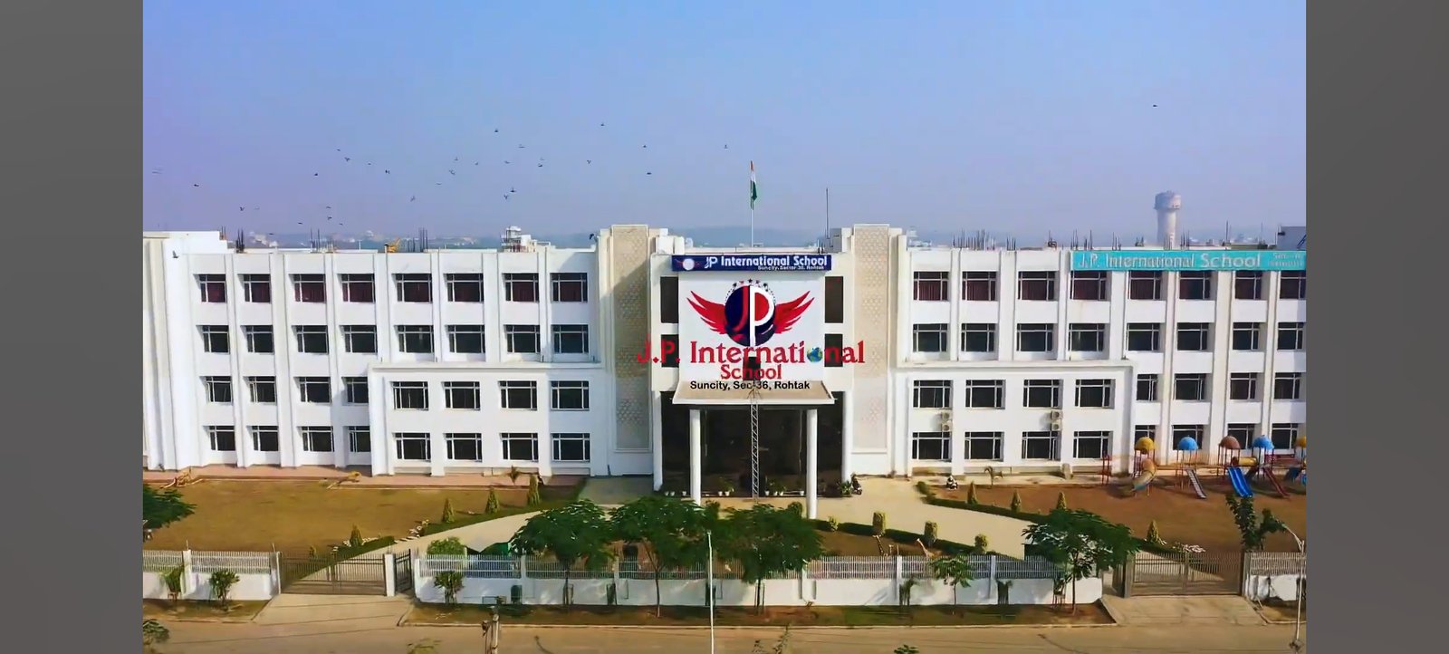 Aerial View of JP International School Campus Aerial drone view of JP International School campus and sports grounds in Sector 36 Rohtak