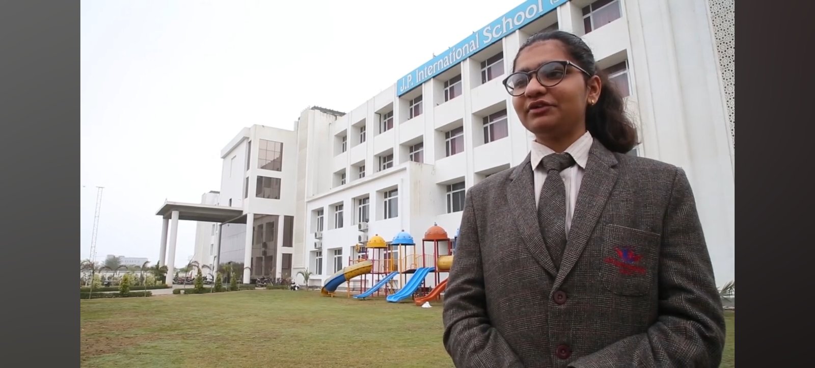 Student Public Speaking & Leadership Student in school blazer speaking outdoors at JP International School campus in Rohtak